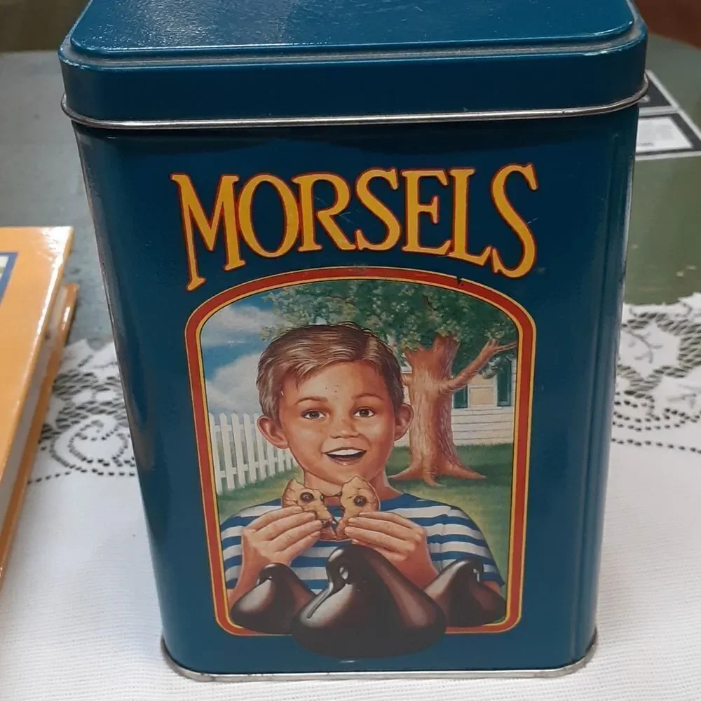 3-pc. Nestle's chocolate bundle: 2‎ vintage tins and a hardcover cookbook